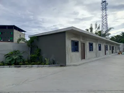 Single-storey administrative office building with a concrete apron