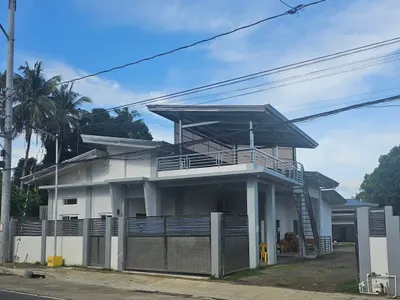 Two-storey house with a roof deck and steel gate