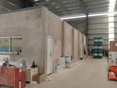 Stock room under a steel roof with plastered walls